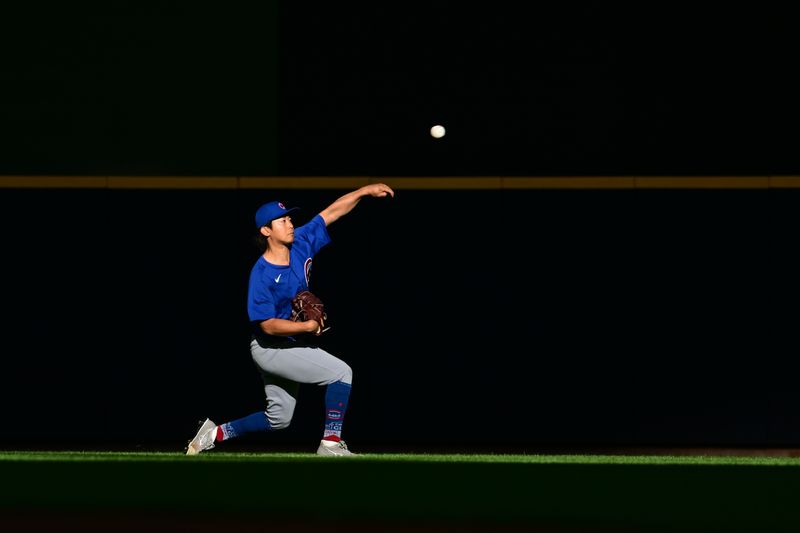 May 29, 2024; Milwaukee, Wisconsin, USA; Chicago Cubs starting pitcher Shota Imanaga (18) warms up before game against the Milwaukee Brewers at American Family Field. Mandatory Credit: Benny Sieu-USA TODAY Sports