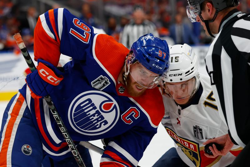 Jun 15, 2024; Edmonton, Alberta, CAN; Edmonton Oilers center Connor McDavid (97) faces off against Florida Panthers center Anton Lundell (15) in the first period in game four of the 2024 Stanley Cup Final at Rogers Place. Mandatory Credit: Perry Nelson-USA TODAY Sports