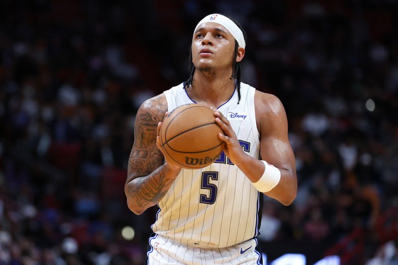 MIAMI, FLORIDA - FEBRUARY 06: Paolo Banchero #5 of the Orlando Magic shoots a free throw against the Miami Heat during the second quarter of the game at Kaseya Center on February 06, 2024 in Miami, Florida. NOTE TO USER: User expressly acknowledges and agrees that, by downloading and or using this photograph, User is consenting to the terms and conditions of the Getty Images License Agreement. (Photo by Megan Briggs/Getty Images)