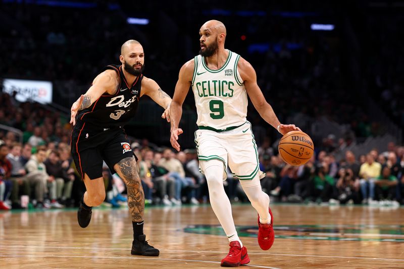 BOSTON, MASSACHUSETTS - MARCH 18: Evan Fournier #31 of the Detroit Pistons defends Derrick White #9 of the Boston Celtics during the first quarter at TD Garden on March 18, 2024 in Boston, Massachusetts. NOTE TO USER: User expressly acknowledges and agrees that, by downloading and or using this photograph, user is consenting to the terms and conditions of the Getty Images License Agreement. (Photo by Maddie Meyer/Getty Images)