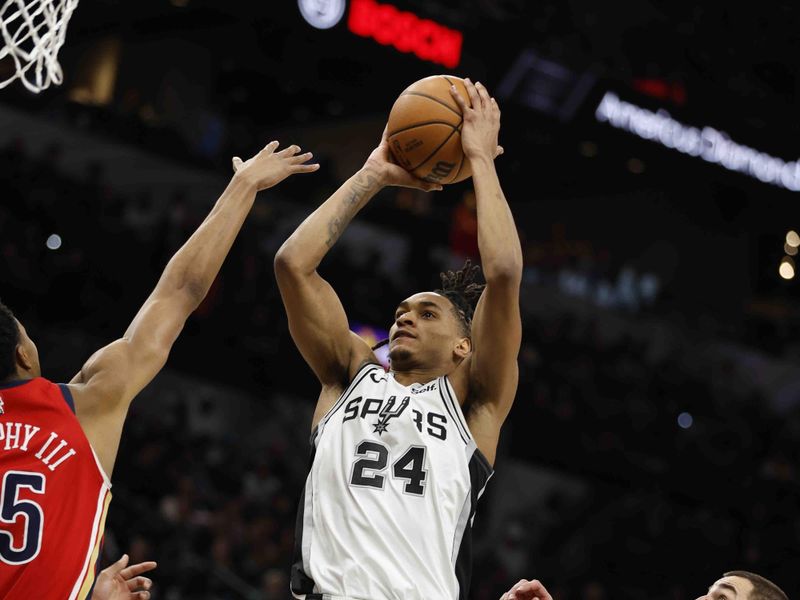 SAN ANTONIO, TX - DECEMBER 17: Devin Vassell #24 of the San Antonio Spurs drives for two against the New Orleans Pelicans in the second first half at Frost Bank Center on December  17, 2023 in San Antonio, Texas. NOTE TO USER: User expressly acknowledges and agrees that, by downloading and or using this photograph, User is consenting to terms and conditions of the Getty Images License Agreement. (Photo by Ronald Cortes/Getty Images)