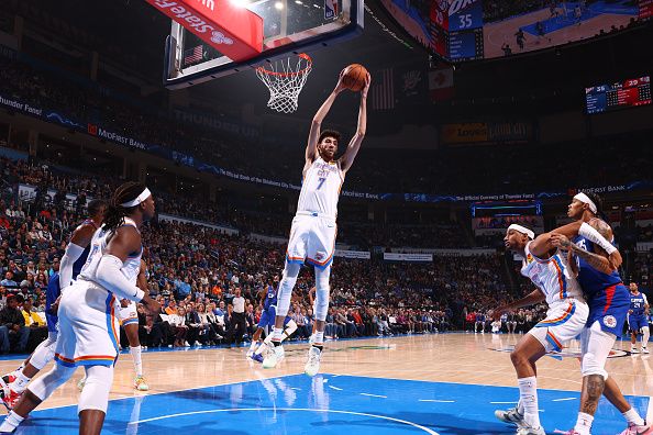 OKLAHOMA CITY, OK - DECEMBER 21: Chet Holmgren #7 of the Oklahoma City Thunder grabs the rebound during the game against the LA Clippers on December 21, 2023 at Paycom Arena in Oklahoma City, Oklahoma. NOTE TO USER: User expressly acknowledges and agrees that, by downloading and or using this photograph, User is consenting to the terms and conditions of the Getty Images License Agreement. Mandatory Copyright Notice: Copyright 2023 NBAE (Photo by Zach Beeker/NBAE via Getty Images)