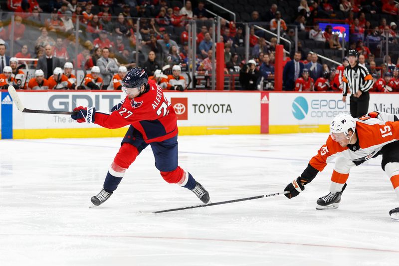 Sep 22, 2024; Washington, District of Columbia, USA; Washington Capitals defenseman Alexander Alexeyev (27)  shoots the puck as Philadelphia Flyers forward Olle Lycksell (15) defends in the third period at Capital One Arena. Mandatory Credit: Geoff Burke-Imagn Images