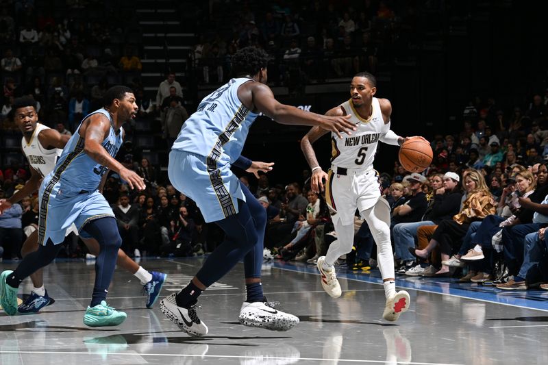 MEMPHIS, TN - NOVEMBER 29: Dejounte Murray #5 of the New Orleans Pelicans handles the ball during the game against the Memphis Grizzlies during the Emirates NBA Cup game on November 29, 2024 at FedExForum in Memphis, Tennessee. NOTE TO USER: User expressly acknowledges and agrees that, by downloading and or using this photograph, User is consenting to the terms and conditions of the Getty Images License Agreement. Mandatory Copyright Notice: Copyright 2024 NBAE (Photo by Grant Burke/NBAE via Getty Images)