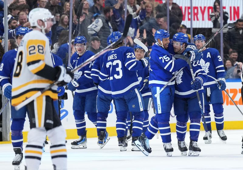 Apr 8, 2024; Toronto, Ontario, CAN; Toronto Maple Leafs defenseman Jake McCabe (22) scores the winning goal and celebrates with right wing Ryan Reaves (75) against the Pittsburgh Penguins during the overtime period at Scotiabank Arena. Mandatory Credit: Nick Turchiaro-USA TODAY Sports