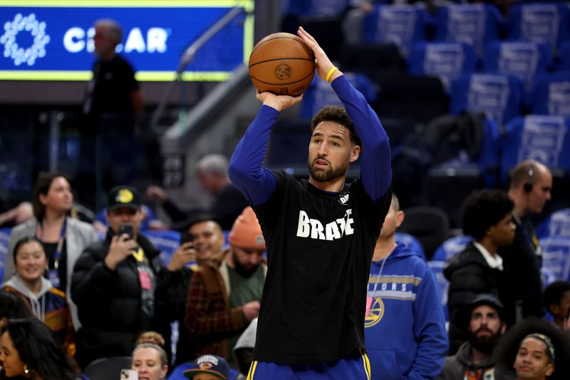 SAN FRANCISCO, CALIFORNIA - JANUARY 24: Klay Thompson #11 of the Golden State Warriorss wears a shirt honoring assistant coach Dejan Milojevic saying 