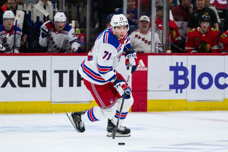 Feb 9, 2024; Chicago, Illinois, USA; New York Rangers center Tyler Pitlick (71) skates with the puck against the Chicago Blackhawks during the first period at the United Center. Mandatory Credit: Daniel Bartel-USA TODAY Sports