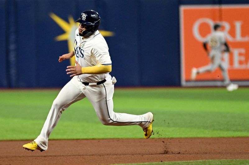 May 29, 2024; St. Petersburg, Florida, USA;Tampa Bay Rays third baseman Isaac Paredes (17) heads for third base in the fourth inning against the Oakland Athletics  at Tropicana Field. Mandatory Credit: Jonathan Dyer-USA TODAY Sports