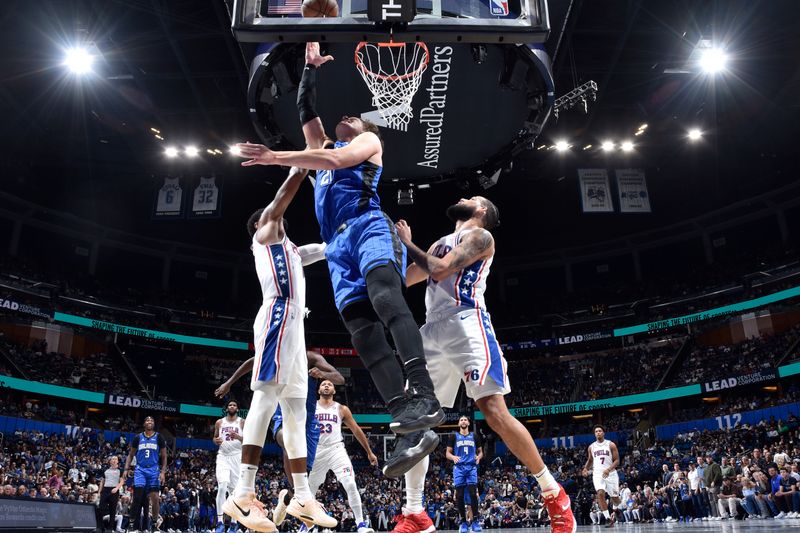 ORLANDO, FL - NOVEMBER 15: Moritz Wagner #21 of the Orlando Magic shoots the ball during the game against the Philadelphia 76ers during the Emirates NBA Cup game on  November 15, 2024 at Kia Center in Orlando, Florida. NOTE TO USER: User expressly acknowledges and agrees that, by downloading and or using this photograph, User is consenting to the terms and conditions of the Getty Images License Agreement. Mandatory Copyright Notice: Copyright 2024 NBAE (Photo by Fernando Medina/NBAE via Getty Images)