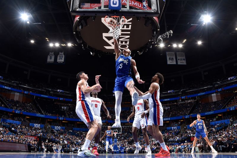 ORLANDO, FL - MARCH 3: Paolo Banchero #5 of the Orlando Magic dunks the ball during the game against the Detroit Pistons on March 3, 2024 at the Kia Center in Orlando, Florida. NOTE TO USER: User expressly acknowledges and agrees that, by downloading and or using this photograph, User is consenting to the terms and conditions of the Getty Images License Agreement. Mandatory Copyright Notice: Copyright 2024 NBAE (Photo by Fernando Medina/NBAE via Getty Images)