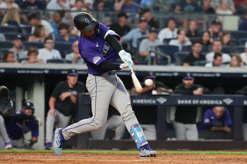 Aug 23, 2024; Bronx, New York, USA; Colorado Rockies left fielder Nolan Jones (22) singles during the third inning against the New York Yankees at Yankee Stadium. Mandatory Credit: Vincent Carchietta-USA TODAY Sports