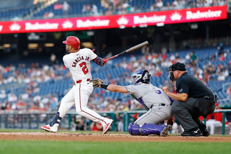 Aug 20, 2024; Washington, District of Columbia, USA; Washington Nationals second baseman Luis García Jr. (2) hits a double against the Colorado Rockies during the second inning at Nationals Park. Mandatory Credit: Geoff Burke-USA TODAY Sports