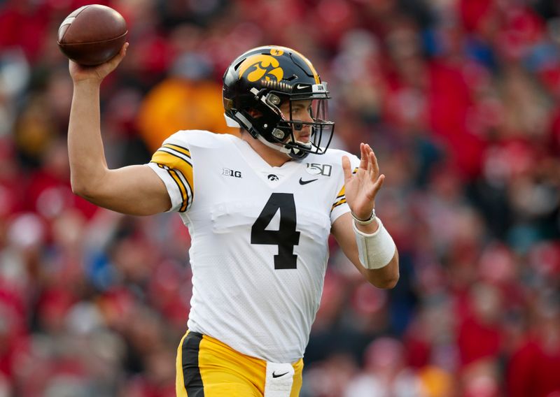 Nov 9, 2019; Madison, WI, USA; Iowa Hawkeyes quarterback Nate Stanley (4) throws a pass during the first quarter against the Wisconsin Badgers at Camp Randall Stadium. Mandatory Credit: Jeff Hanisch-USA TODAY Sports