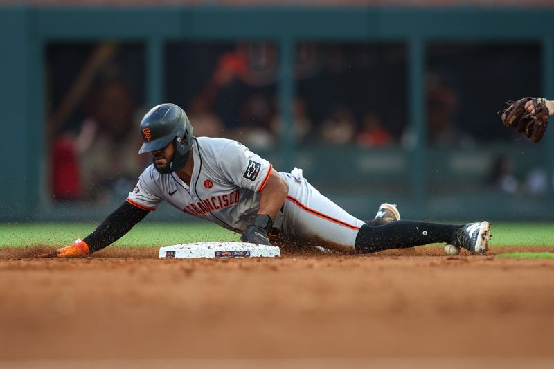 Jul 2, 2024; Atlanta, Georgia, USA; San Francisco Giants center fielder Heliot Ramos (17) steals second base against the Atlanta Braves in the third inning at Truist Park. Mandatory Credit: Brett Davis-USA TODAY Sports