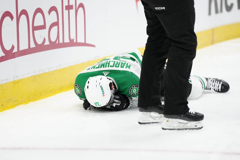 Feb 27, 2024; Denver, Colorado, USA; Dallas Stars left wing Mason Marchment (27) lays on the ice in the third period against the Colorado Avalanche at Ball Arena. Mandatory Credit: Ron Chenoy-USA TODAY Sports