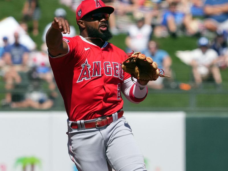 Mar 13, 2024; Surprise, Arizona, USA; Los Angeles Angels second baseman Luis Rengifo (2) throws to first base against the Kansas City Royals during the first inning at Surprise Stadium. Mandatory Credit: Joe Camporeale-USA TODAY Sports