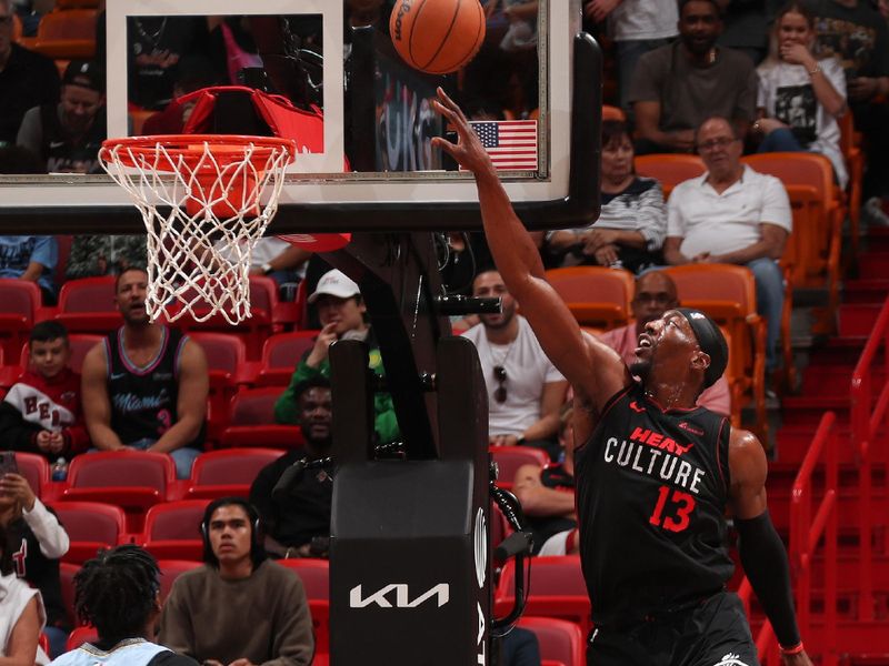 MIAMI, FL - JANUARY 24:  Bam Adebayo #13 of the Miami Heat drives to the basket during the game against the Memphis Grizzlies on January 24, 2024 at Kaseya Center in Miami, Florida. NOTE TO USER: User expressly acknowledges and agrees that, by downloading and or using this Photograph, user is consenting to the terms and conditions of the Getty Images License Agreement. Mandatory Copyright Notice: Copyright 2024 NBAE (Photo by Issac Baldizon/NBAE via Getty Images)