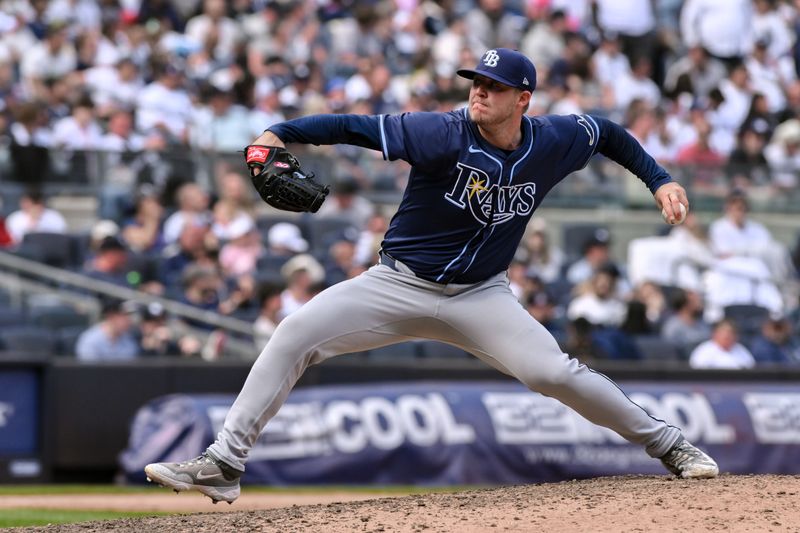 Apr 20, 2024; Bronx, New York, USA; Tampa Bay Rays pitcher Garrett Cleavinger (60) pitches during the tenth inning against the New York Yankees at Yankee Stadium. Mandatory Credit: John Jones-USA TODAY Sports