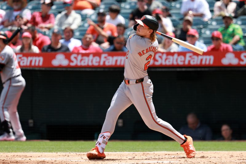 Apr 24, 2024; Anaheim, California, USA;  Baltimore Orioles shortstop Gunnar Henderson (2) hits a home run during the third inning against the Los Angeles Angels at Angel Stadium. Mandatory Credit: Kiyoshi Mio-USA TODAY Sports