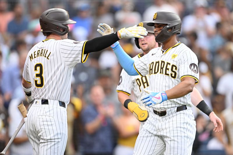 Sep 5, 2024; San Diego, California, USA; San Diego Padres second baseman Xander Bogaerts (2) is congratulated by Jackson Merrill (3) after hitting a two-run home run during the second inning against the Detroit Tigers at Petco Park. Mandatory Credit: Denis Poroy-Imagn Images