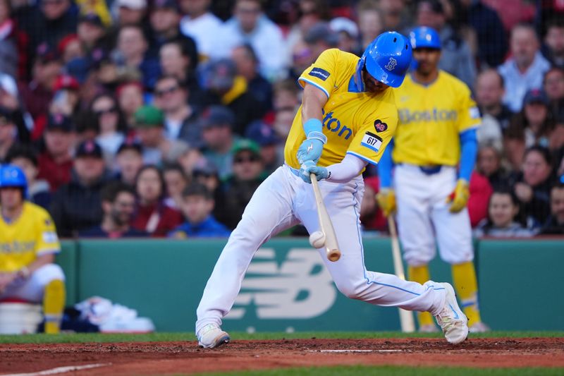 May 11, 2024; Boston, Massachusetts, USA; Boston Red Sox catcher Reese McGuire (3) hits a single against the Washington Nationals during the fifth inning at Fenway Park. Mandatory Credit: Gregory Fisher-USA TODAY Sports