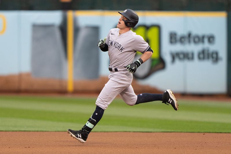 Jun 28, 2023; Oakland, California, USA;  New York Yankees center fielder Harrison Bader (22) runs towards second base after hitting a double during the fourth inning against the Oakland Athletics at Oakland-Alameda County Coliseum. Mandatory Credit: Stan Szeto-USA TODAY Sports