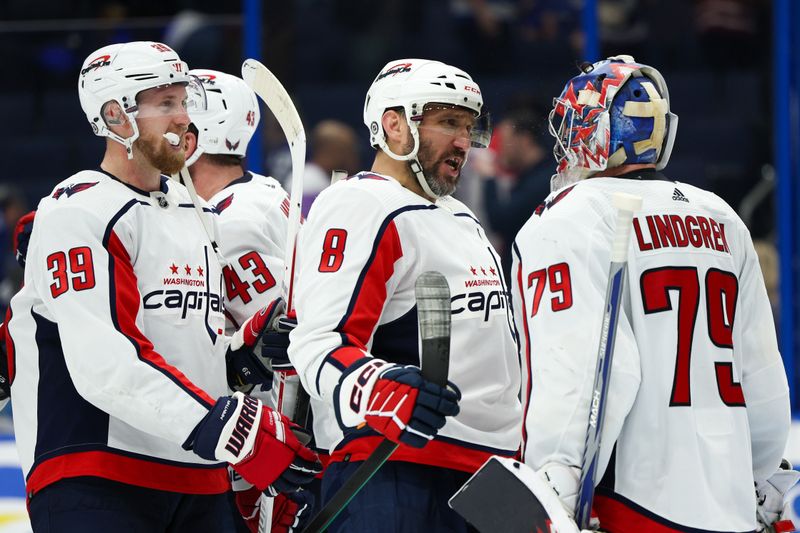 Feb 22, 2024; Tampa, Florida, USA;  Washington Capitals left wing Alex Ovechkin (8) and goaltender Charlie Lindgren (79) celebrate after beating the Tampa Bay Lightning at Amalie Arena. Mandatory Credit: Nathan Ray Seebeck-USA TODAY Sports