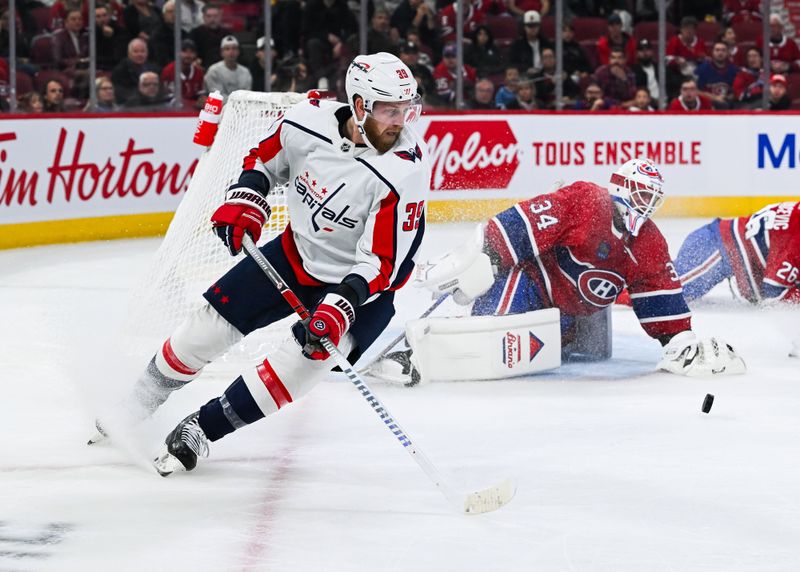 Oct 21, 2023; Montreal, Quebec, CAN; Montreal Canadiens goalie Jake Allen (34) makes a save against Washington Capitals right wing Anthony Mantha (39) during the first period at Bell Centre. Mandatory Credit: David Kirouac-USA TODAY Sports