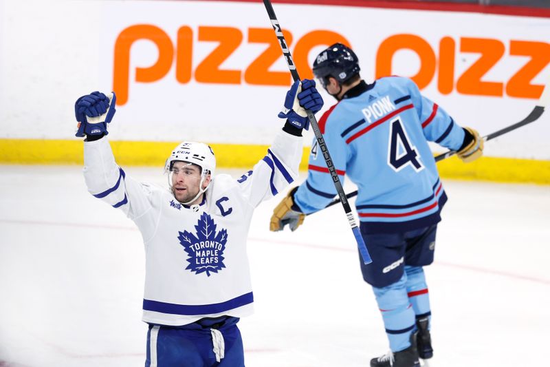 Jan 27, 2024; Winnipeg, Manitoba, CAN; Toronto Maple Leafs center John Tavares (91) celebrates his third period goal against the Winnipeg Jets at Canada Life Centre. Mandatory Credit: James Carey Lauder-USA TODAY Sports