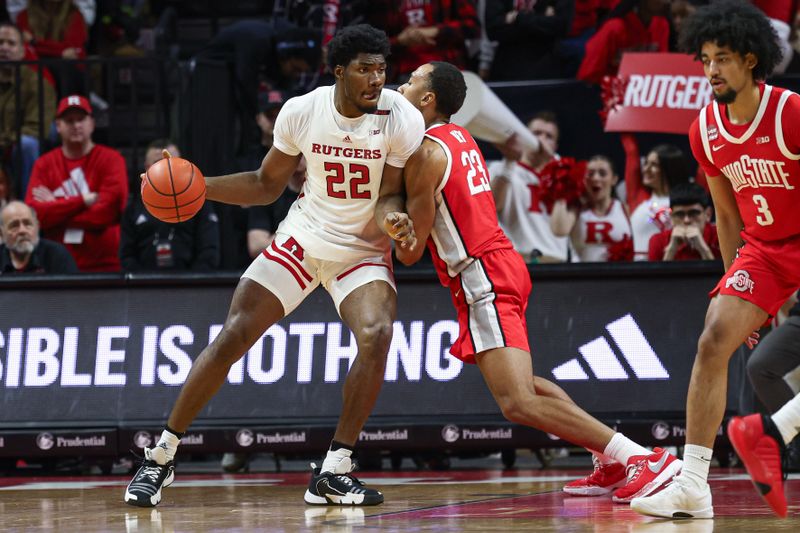 Mar 10, 2024; Piscataway, New Jersey, USA; Rutgers Scarlet Knights center Emmanuel Ogbole (22) dribbles against Ohio State Buckeyes forward Zed Key (23) during the first half at Jersey Mike's Arena. Mandatory Credit: Vincent Carchietta-USA TODAY Sports