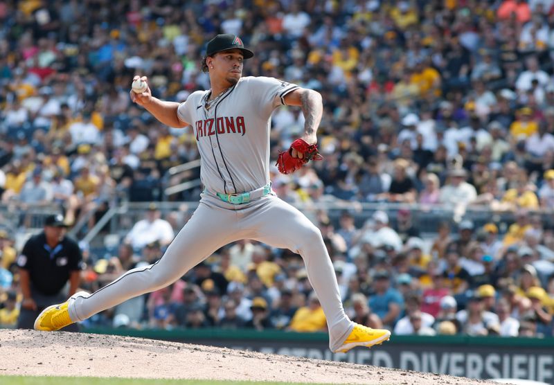 Aug 4, 2024; Pittsburgh, Pennsylvania, USA;  Arizona Diamondbacks relief pitcher Justin Martinez (63) pitches against the Pittsburgh Pirates during the seventh inning at PNC Park. Mandatory Credit: Charles LeClaire-USA TODAY Sports