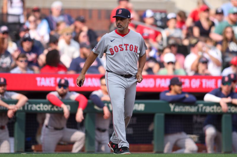 May 31, 2025; Atlanta, Georgia, USA; Boston Red Sox manager Alex Cora (13) makes a pitching change against the Atlanta Braves in the sixth inning at Truist Park. Mandatory Credit: Brett Davis-Imagn Images