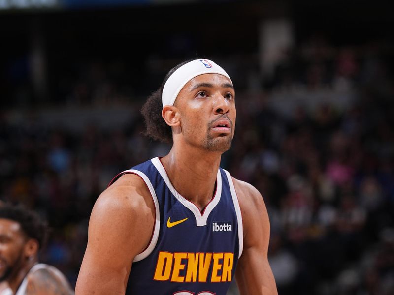 DENVER, CO - FEBRUARY 14: Zeke Nnaji #22 of the Denver Nuggets shoots a free throw during the game against the Sacramento Kings on February 14, 2024 at the Ball Arena in Denver, Colorado. NOTE TO USER: User expressly acknowledges and agrees that, by downloading and/or using this Photograph, user is consenting to the terms and conditions of the Getty Images License Agreement. Mandatory Copyright Notice: Copyright 2024 NBAE (Photo by Bart Young/NBAE via Getty Images)