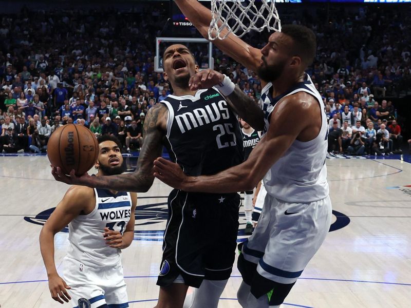 DALLAS, TEXAS - MAY 28:  P.J. Washington #25 of the Dallas Mavericks attempts a shot against Rudy Gobert #27 of the Minnesota Timberwolves during the fourth quarter in Game Four of the Western Conference Finals at American Airlines Center on May 28, 2024 in Dallas, Texas. NOTE TO USER: User expressly acknowledges and agrees that, by downloading and or using this photograph, User is consenting to the terms and conditions of the Getty Images License Agreement. (Photo by Matthew Stockman/Getty Images)