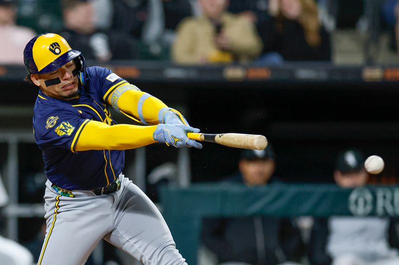 Apr 29, 2025; Chicago, Illinois, USA; Milwaukee Brewers catcher William Contreras (24) hits an RBI-single against the Chicago White Sox during the sixth inning at Rate Field. Mandatory Credit: Kamil Krzaczynski-Imagn Images
