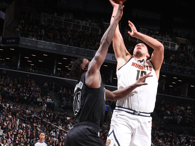 BROOKLYN, NY - OCTOBER 29: Nikola Jokic #15 of the Denver Nuggets drives to the basket during the game against the Brooklyn Nets on October 29, 2024 at Barclays Center in Brooklyn, New York. NOTE TO USER: User expressly acknowledges and agrees that, by downloading and or using this Photograph, user is consenting to the terms and conditions of the Getty Images License Agreement. Mandatory Copyright Notice: Copyright 2024 NBAE (Photo by Nathaniel S. Butler/NBAE via Getty Images)