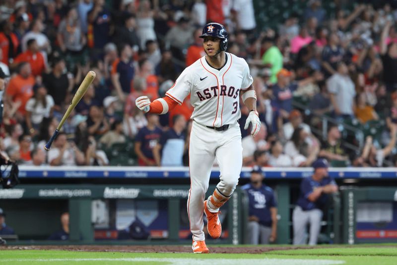May 31, 2025; Houston, Texas, USA; Houston Astros shortstop Jeremy Pena (3) flips his bat after hitting a home run during the third inning against the Tampa Bay Rays at Daikin Park. Mandatory Credit: Troy Taormina-Imagn Images