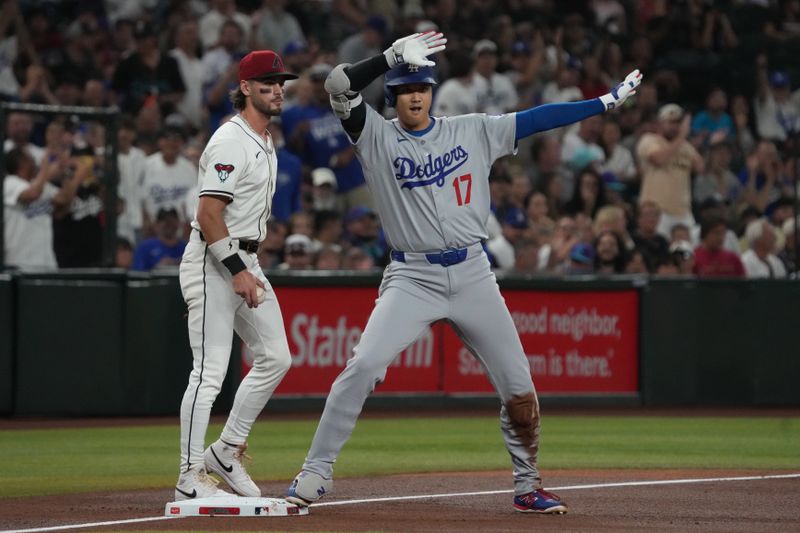 Sep 24, 2025; Phoenix, Arizona, USA; Los Angeles Dodgers designated hitter Shohei Ohtani (17) reacts after hitting a triple against the Arizona Diamondbacks in the first inning at Chase Field. Mandatory Credit: Rick Scuteri-Imagn Images