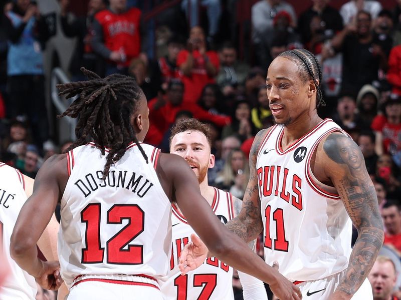 CHICAGO, IL - MARCH 18:  DeMar DeRozan #11 and Ayo Dosunmu #12 of the Chicago Bulls react during the game against the Portland Trail Blazers on March 18, 2024 at United Center in Chicago, Illinois. NOTE TO USER: User expressly acknowledges and agrees that, by downloading and or using this photograph, User is consenting to the terms and conditions of the Getty Images License Agreement. Mandatory Copyright Notice: Copyright 2024 NBAE (Photo by Jeff Haynes/NBAE via Getty Images)