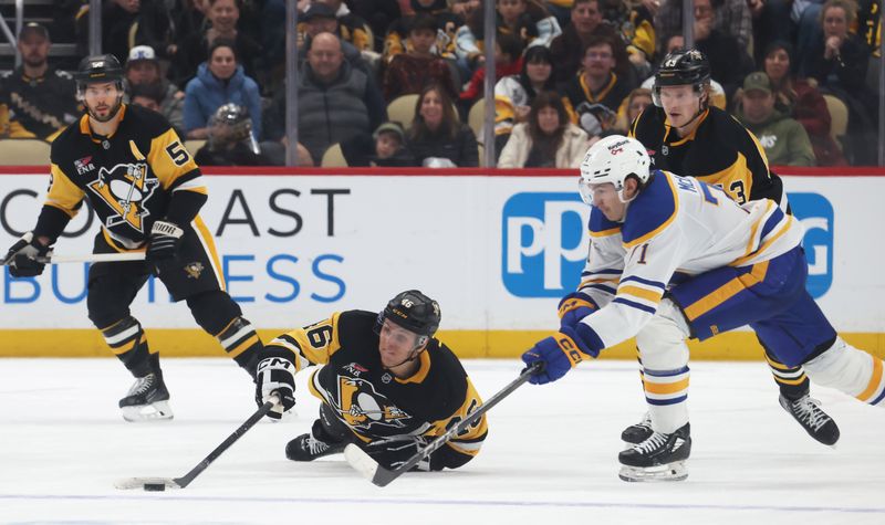 Nov 26, 2025; Pittsburgh, Pennsylvania, USA; Pittsburgh Penguins center Blake Lizotte (46) dives to knock the puck away from Buffalo Sabres center Ryan McLeod (71) during the third period at PPG Paints Arena. Mandatory Credit: Charles LeClaire-Imagn Images