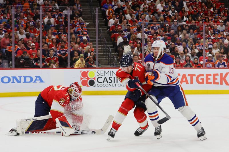 Jun 24, 2024; Sunrise, Florida, USA; Florida Panthers defenseman Niko Mikkola (77) and goaltender Sergei Bobrovsky (72) defend against Edmonton Oilers forward Mattias Janmark (13) during the third period in game seven of the 2024 Stanley Cup Final at Amerant Bank Arena. Mandatory Credit: Sam Navarro-USA TODAY Sports