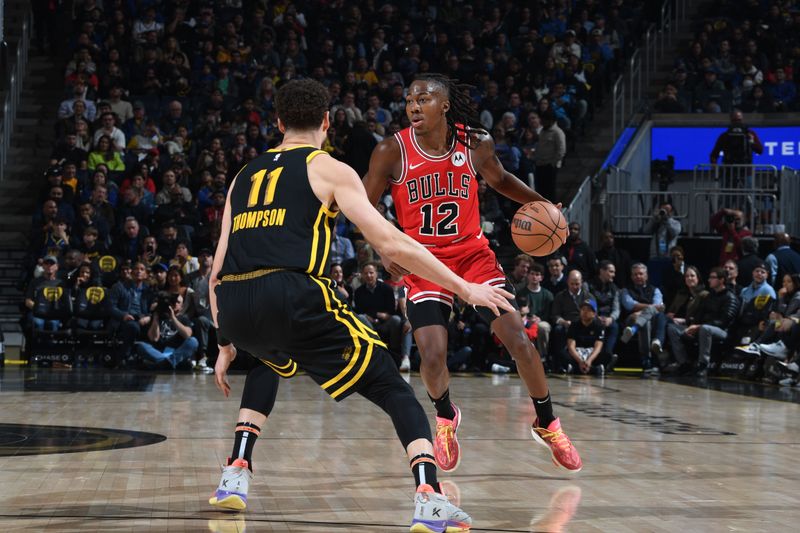 SAN FRANCISCO, CA - MARCH 7: Ayo Dosunmu #12 of the Chicago Bulls handles the ball during the game against the Golden State Warriors on March 7, 2024 at Chase Center in San Francisco, California. NOTE TO USER: User expressly acknowledges and agrees that, by downloading and or using this photograph, user is consenting to the terms and conditions of Getty Images License Agreement. Mandatory Copyright Notice: Copyright 2024 NBAE (Photo by Noah Graham/NBAE via Getty Images)