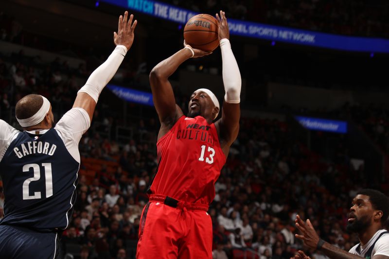 MIAMI, FL - NOVEMBER 24: Bam Adebayo #13 of the Miami Heat shoots the ball during the game against the Dallas Mavericks on November 24, 2024 at Kaseya Center in Miami, Florida. NOTE TO USER: User expressly acknowledges and agrees that, by downloading and or using this Photograph, user is consenting to the terms and conditions of the Getty Images License Agreement. Mandatory Copyright Notice: Copyright 2024 NBAE (Photo by Issac Baldizon/NBAE via Getty Images)