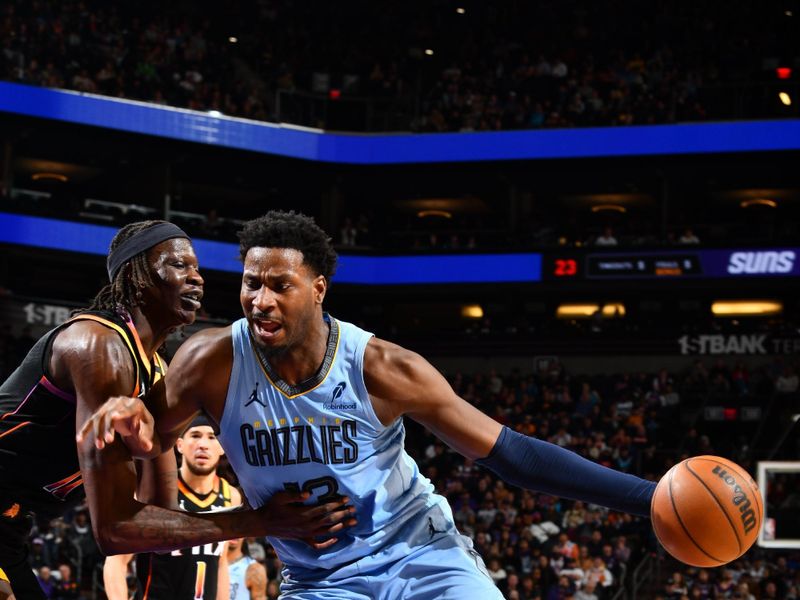 PHOENIX, AZ - FEBRUARY 11:  Jaren Jackson Jr. #13 of the Memphis Grizzlies dribbles the ball during the game against the Phoenix Suns on February 11, 2025 at Footprint Center in Phoenix, Arizona. NOTE TO USER: User expressly acknowledges and agrees that, by downloading and or using this photograph, user is consenting to the terms and conditions of the Getty Images License Agreement. Mandatory Copyright Notice: Copyright 2025 NBAE (Photo by Barry Gossage/NBAE via Getty Images)