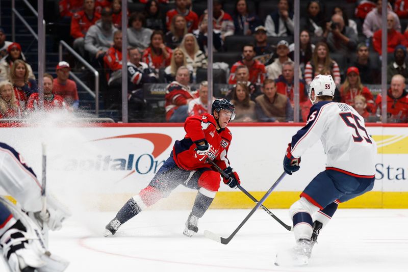 Nov 2, 2024; Washington, District of Columbia, USA; Washington Capitals left wing Jakub Vrana (13) skates with the puck as Columbus Blue Jackets defenseman David Jiricek (55) defends in the third period at Capital One Arena. Mandatory Credit: Geoff Burke-Imagn Images