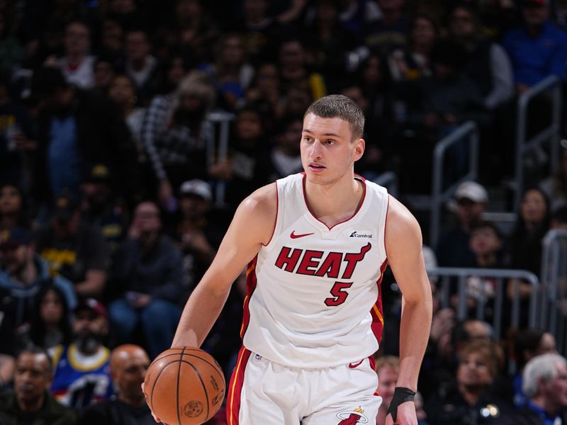 DENVER, CO - FEBRUARY 29: Nikola Jovic #5 of the Miami Heat dribbles the ball during the game against the Denver Nuggets on February 29, 2024 at the Ball Arena in Denver, Colorado. NOTE TO USER: User expressly acknowledges and agrees that, by downloading and/or using this Photograph, user is consenting to the terms and conditions of the Getty Images License Agreement. Mandatory Copyright Notice: Copyright 2024 NBAE (Photo by Garrett Ellwood/NBAE via Getty Images)