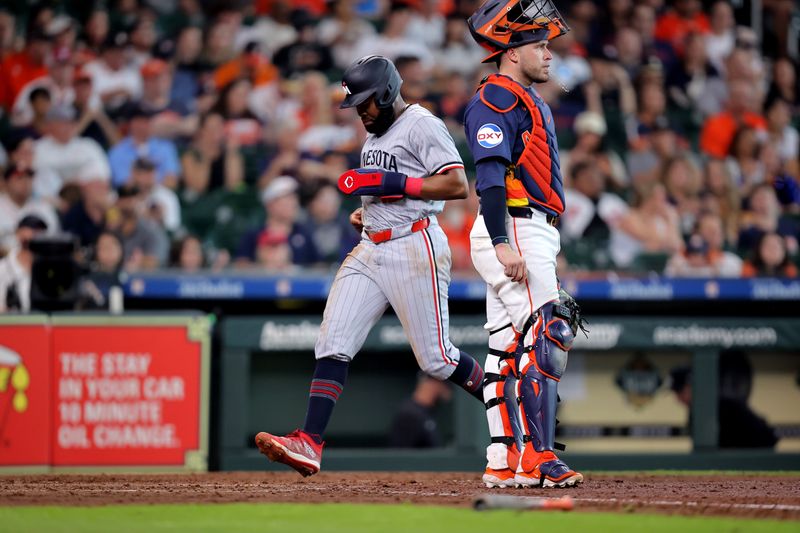 Jun 1, 2024; Houston, Texas, USA; Minnesota Twins right fielder Manuel Margot (13) crosses home plate to score a run against the Houston Astros during the seventh inning at Minute Maid Park. Mandatory Credit: Erik Williams-USA TODAY Sports