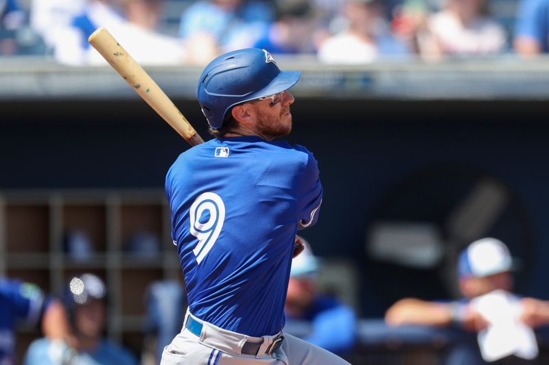 Mar 11, 2024; Port Charlotte, Florida, USA;  Toronto Blue Jays catcher Danny Janen (9) hits a two-run home run against the Tampa Bay Rays in the fourth inning at Charlotte Sports Park. Mandatory Credit: Nathan Ray Seebeck-USA TODAY Sports