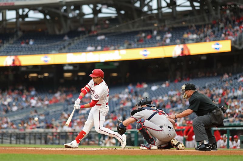 May 20, 2025; Washington, District of Columbia, USA; Washington Nationals first baseman Nathaniel Lowe (33) singles against the Atlanta Braves during the first inning at Nationals Park. Mandatory Credit: Geoff Burke-Imagn Images