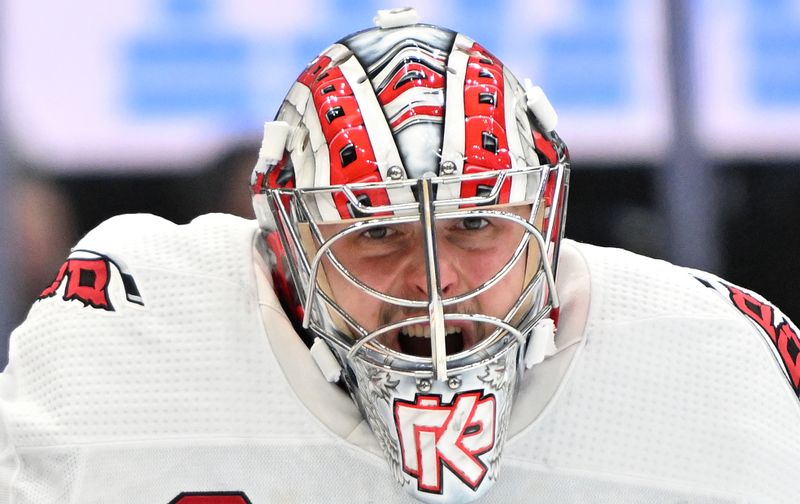 Dec 30, 2023; Toronto, Ontario, CAN; Carolina Hurricanes goalie Pyotr Kochetkov (52) reacts as he waits for play to begin against the Toronto Maple Leafs in the first period at Scotiabank Arena. Mandatory Credit: Dan Hamilton-USA TODAY Sports